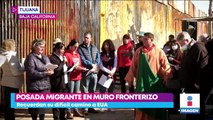 Migrantes en Tijuana realizan posada con piñata de muro fronterizo