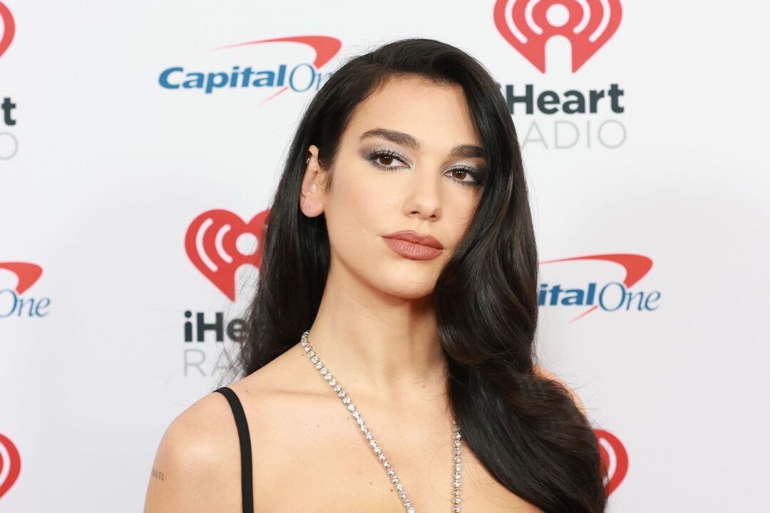 Dua Lipa Dialed Up the Drama in a Black Cutout Gown with a Crystalized Halter Strap