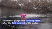 Outdoor swimmers brave near-freezing water as snow hits London