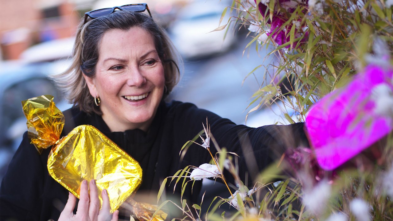Big-hearted residents of Britain's 'real-life Quality Street' have adorned their homes with huge sweet decorations to raise foodbank donations for those in need this Christmas.