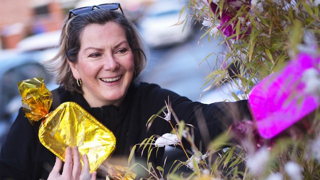 Big-hearted residents of Britain's 'real-life Quality Street' have adorned their homes with huge sweet decorations to raise foodbank donations for those in need this Christmas.