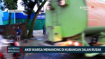 Aksi Warga Memancing di Kubangan Jalan Rusak