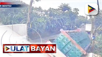 Truck na bumangga sa isa pang truck, nasapul ng CCTV; Daan-daang bote ng alak, pinagkaguluhan ng mga residente