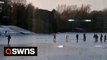 Shocking footage shows group of Brits sliding & skating on frozen lake - just days after four boys died falling through ice
