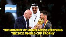 THE MOMENT OF LIONEL MESSI RECEIVING THE 2022 WORLD CUP TROPHY