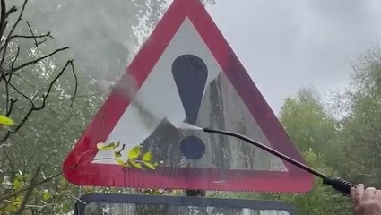 Cleaning Algae-Covered Street Signs