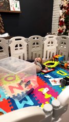 Wild Child Playing in Playpen Tumbles off Plastic Box