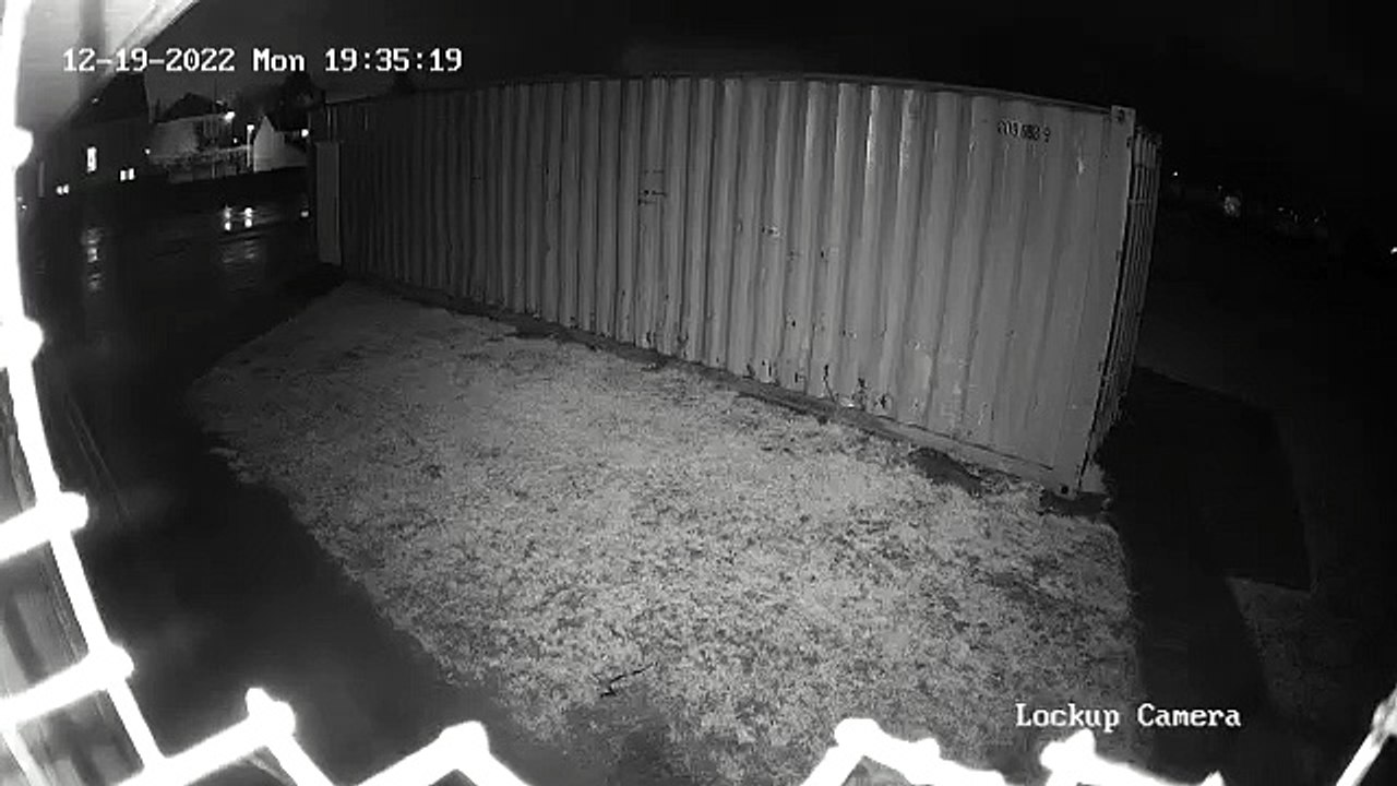 A figure attempts to open storage units at King...