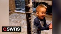 Adorable moment little boy sees snow for the first time