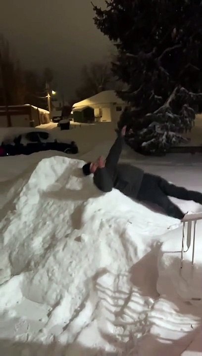Leaping Into the Snow in Slow Motion