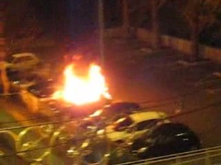 Car on fire.  Exploding window