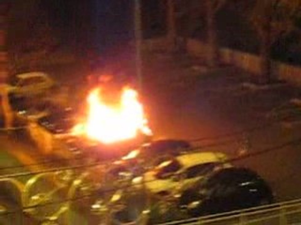 Car on fire.  Exploding window
