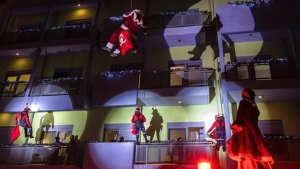 Greek firefighters dressed as Santa give presents to children with cancer