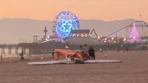 Small plane flips over during crash landing on Santa Monica beach