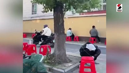 ચીનમાં કોરોનાનું વિકરાળ સ્વરૂપ: રસ્તા પર દોરડું બાંધી બોટલો ચઢાવી