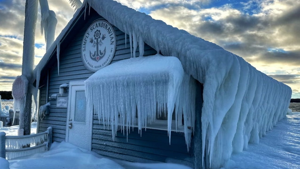 Lake Michigan waves cover Wisconsin shop in ice as blizzard ravages US
