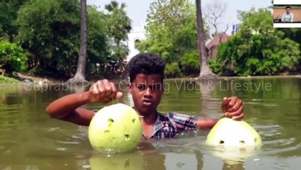 Amazing fish trapping method | boy build fishing trap with bitter gourd in village pond 