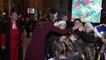 Kate Middleton jokes about her singing voice and high-fives children at carol concert