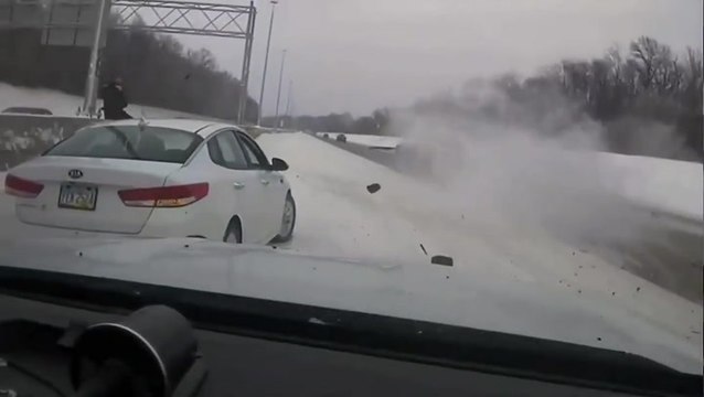 Ohio police officer narrowly avoids being hit by skidding truck on icy road