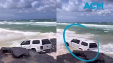4WD gone wrong: Driver bogged before almost getting wiped out by waves