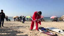 Gaza Santas trade sleighs for water-skis