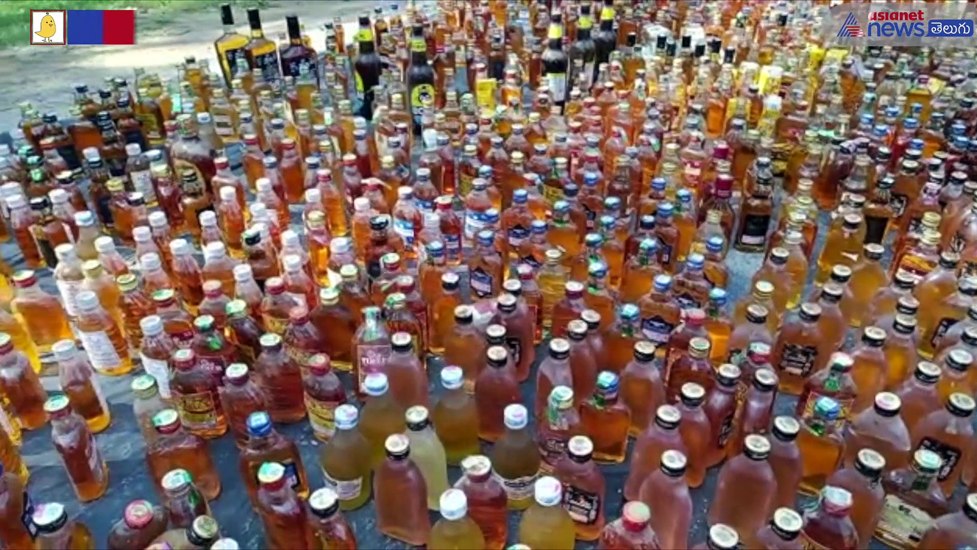 మందుబాటిల్స్ కుప్పలపైకి రోడ్డురోలర్ ఎక్కించి... 2022కు ఏపీ పోలీసులు వినూత్న వీడ్కోలు