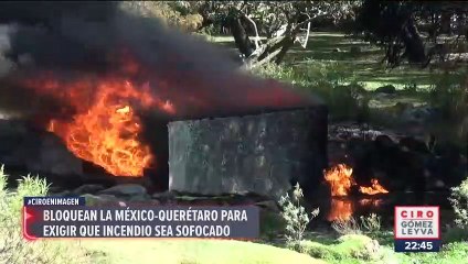 Bloquean la México-Querétaro para exigir que incendio sea sofocado