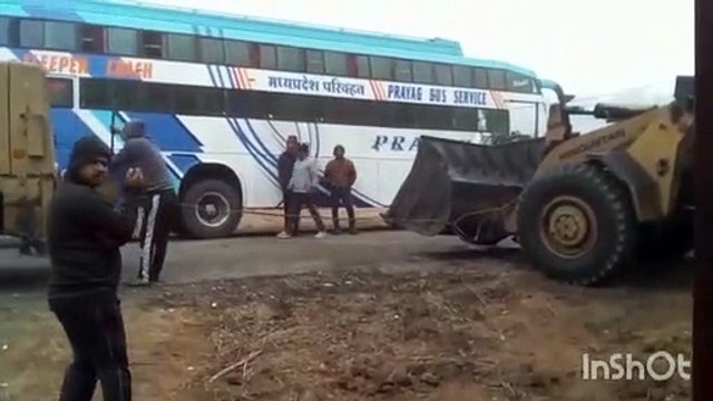 Five passengers were injured in a head-on collision between a loader and a bus