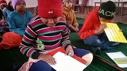 Dots are engraved on paper with stylus, words are underst