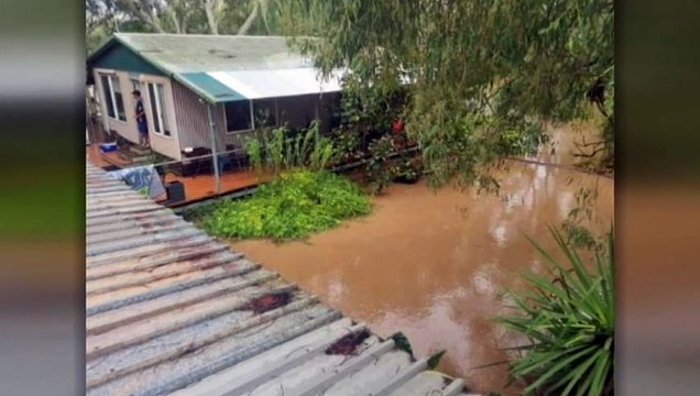 Major floods and wild weather isolate towns across northern Australia as ex-Tropical Cyclone Ellie maintains strength