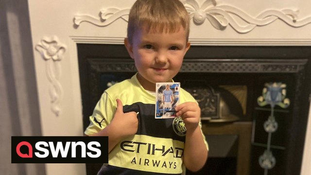 Adorable moment young Manchester City fan receives Match Attax card of his favourite player