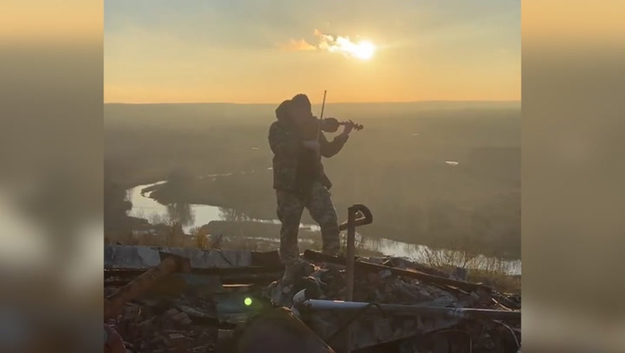 Ukrainian soldier plays violin in reclaimed city in Kharkiv Oblast