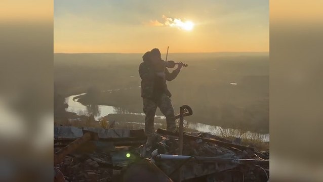 Ukrainian soldier plays violin in reclaimed city in Kharkiv Oblast