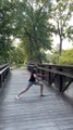 Guy Displays Impressive Bo Staff Skills on Bridge