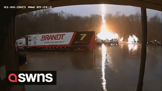 CCTV captures moment stray lightning bolt strikes parked car sending sparks flying across parking lot