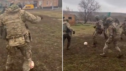 Ukrainian soldiers play football match on battlefield as war continues