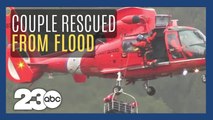 Coast Guard rescues couple and dog trapped by flood