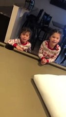 Little Girl Holds the Elf-On-The-Shelf