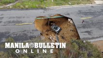 Massive sinkhole swallows two vehicles in Los Angeles