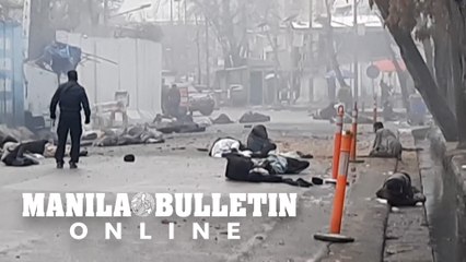 Bodies were strewn across the street in Kabul after a suicide bomb attack