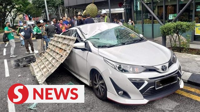 Car on Jalan Ampang damaged by falling construction material