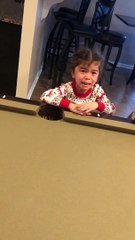 Little Girl Holds the Elf-On-The-Shelf