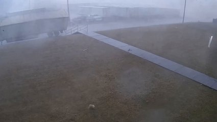 Moment Georgia tornado flips semi-truck captured on security camera