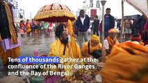 Thousands of Hindu pilgrims take a holy dip in the Ganges