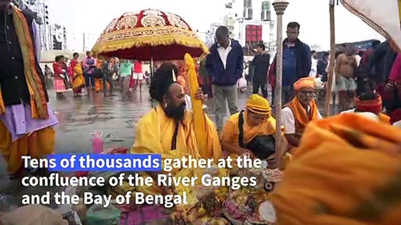 Thousands of Hindu pilgrims take a holy dip in the Ganges