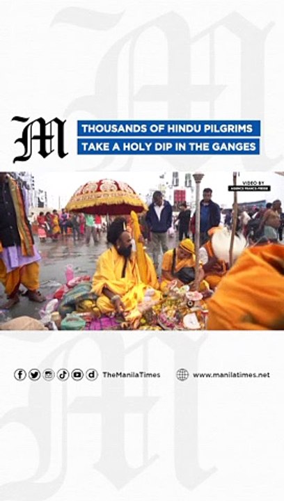 Thousands of Hindu pilgrims take a holy dip in the Ganges