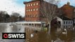 Huge areas of a city centre have been turned into lakes as rising water levels engulfed fields gardens, buildings and even a racecourse