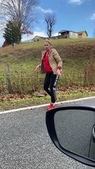 Woman Tries to Help Snapping Turtle off the Road