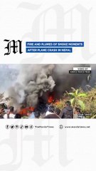 Fire and plumes of smoke moments after plane crash in Nepal