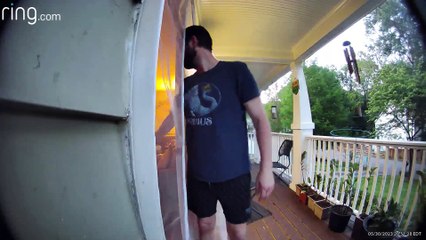 Rat Startles Man When It Jumps Off Birdfeeder